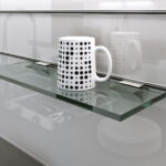 Handle for a glass shelf