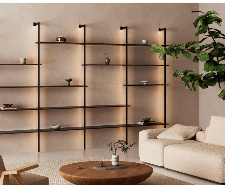 Zobal EVA light shelving system in a minimalist living room, four bays of lit black shelves on a plaster wall